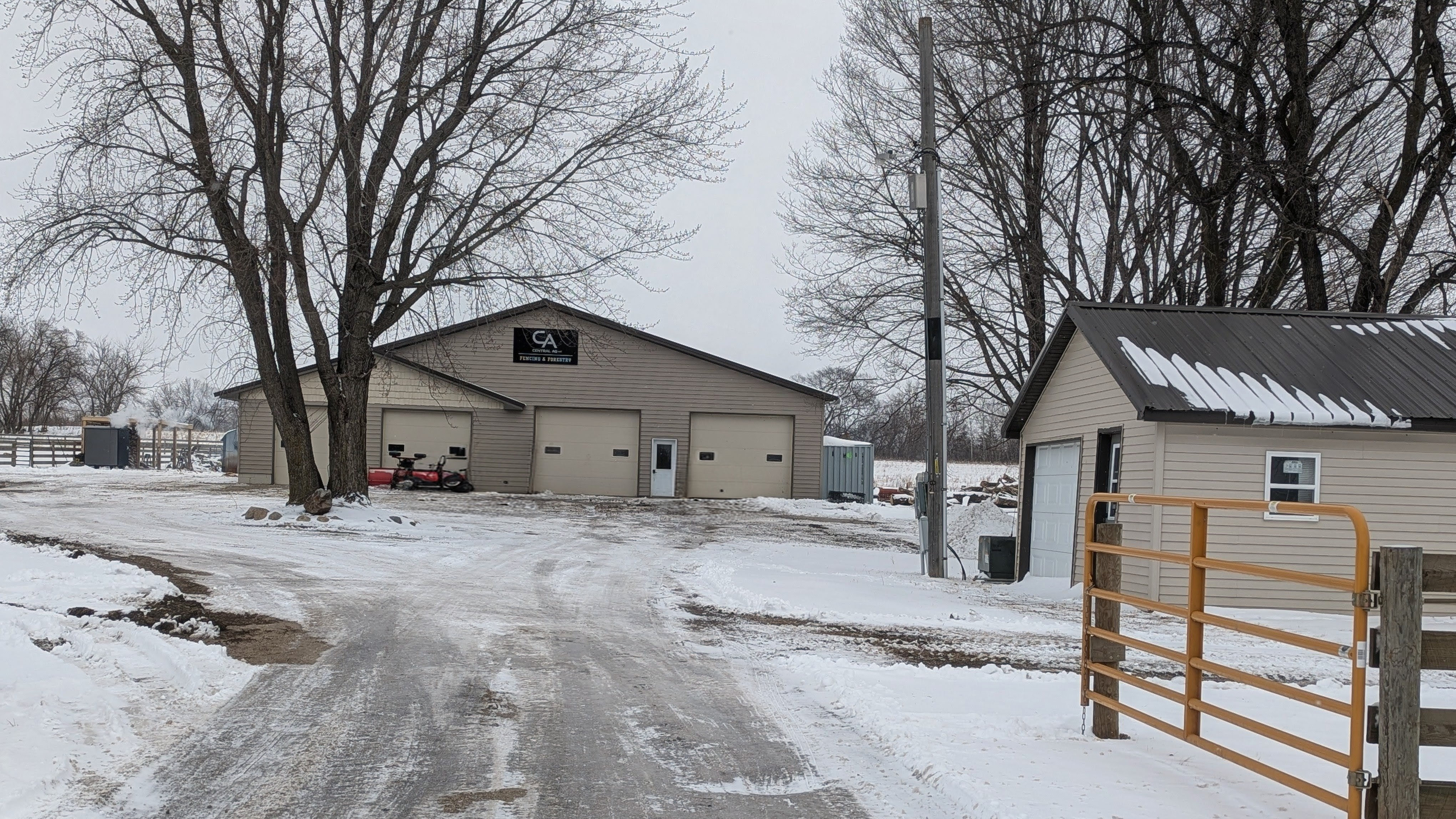 Central Ag property and timber gate in winter
